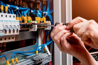 person-fixing-home-electrical-system